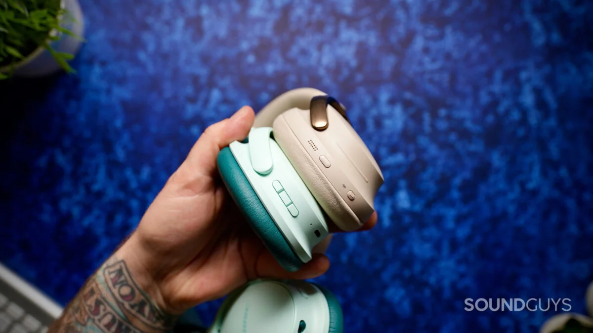 Side view of the Bose QuietComfort Headphones (2nd Gen) and QuietComfort Ultra Headphones (2nd Gen), showing their different button layouts.