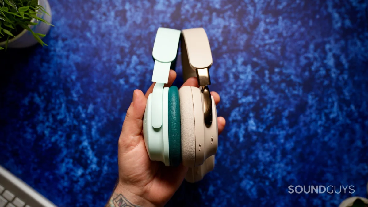 Side-by-side profile of the mint green Bose QuietComfort Headphones (2nd Gen) and beige Bose QuietComfort Ultra Headphones (2nd Gen).
