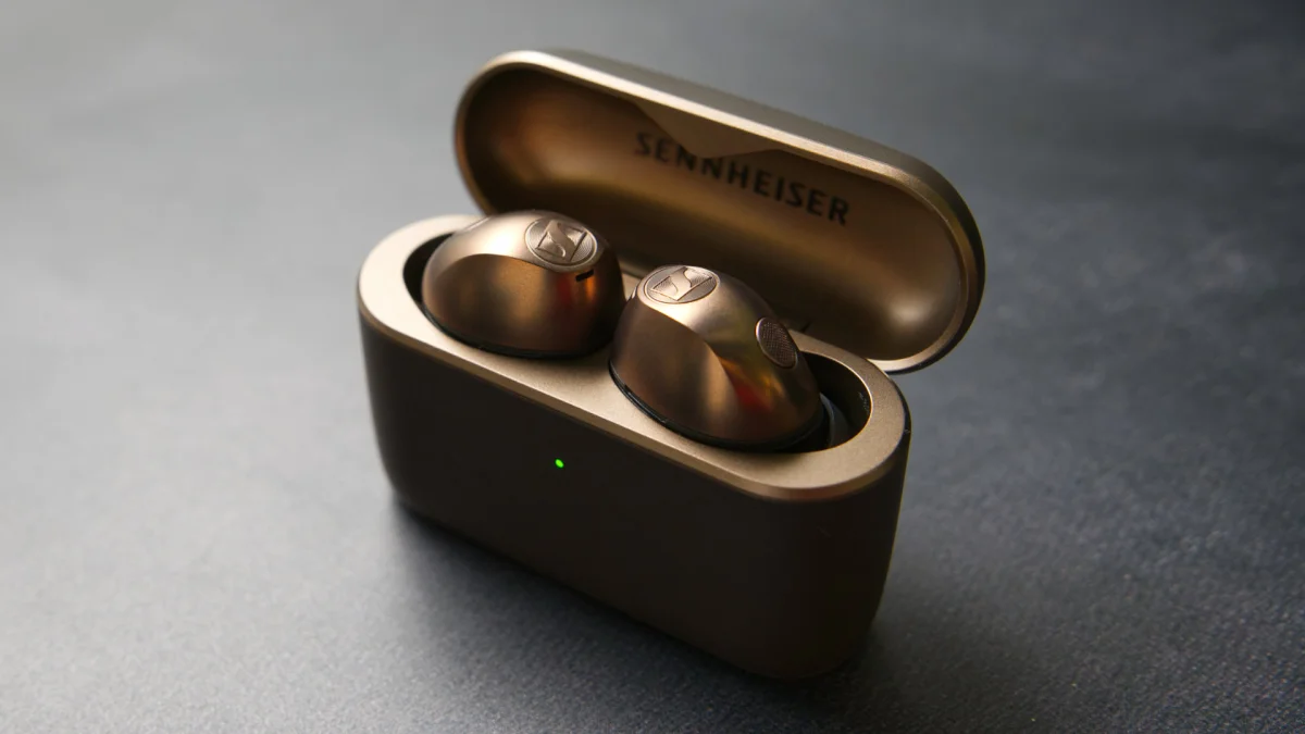 A photo of the Sennheiser MOMENTUM True Wireless 5 on a desk.