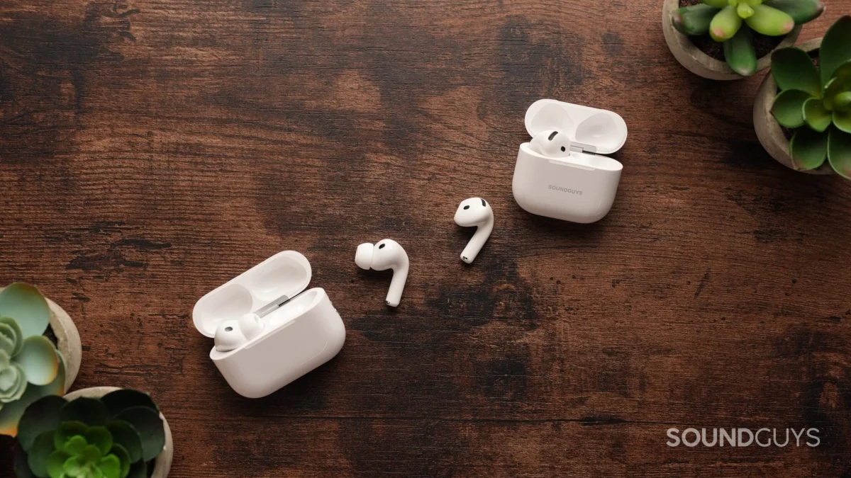 The AirPods Pro 3 and AirPods 4 sit on a table. Each right earbud sits in the centre.