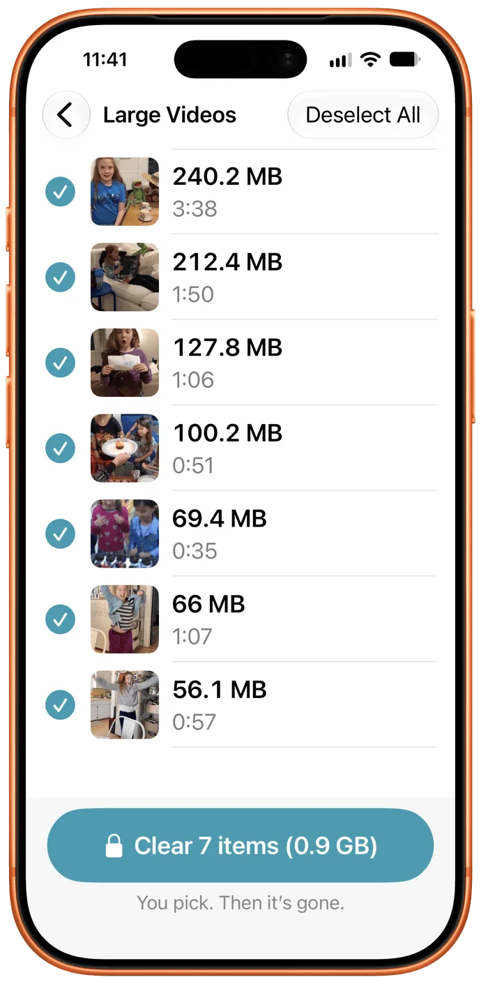 iPhone screenshot of a "Large Videos" screen with seven checked videos: 240.2 MB (3:38), 212.4 MB (1:50), 127.8 MB (1:06), 100.2 MB (0:51), 69.4 MB (0:35), 66 MB (1:07), 56.1 MB (0:57). A button reads "Clear 7 items (0.9 GB)"; below: "You pick. Then it's gone."